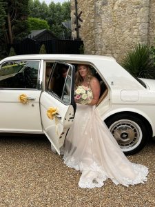 Bride arriving in Rolls-Royce wedding car in Kent with chauffeur service by Lady R
